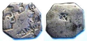 Silver punch-mark coins of the Mauryan empire bear Buddhist symbols such as the dharma wheel, the elephant (previous form of the Buddha), the tree under which enlightenment happened, and the burial mound where the Buddha died (third century B.C.E.)