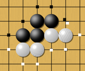 This picture shows one black unit and two white units. Their respective liberties are shown with dots. Note that liberties are shared among all the stones of a unit. If White plays where his two units share a liberty, they will be connected into one.