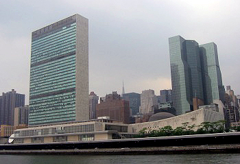 United Nations headquarters in New York City, viewed from the East River. The Secretariat tower is on the left and the General Assembly building is the low structure to the right of the tower