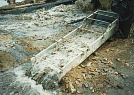 A sluice box used in placer mining