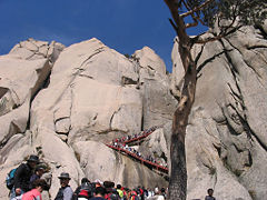 Hikers climbing on Ulsan Bawi