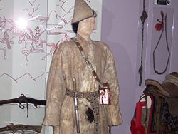 Tibetan herdsman's coat, fur-lined. A portable shrine for worship was carried with a shoulder strap. (Field Museum)