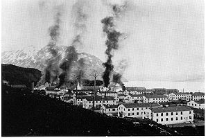 Buildings burning after the first enemy attack on Dutch Harbor, June 3, 1942.