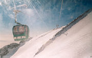 A gondola lift carrying skiers and other visitors to Tochal Mountain near Tehran