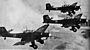 A flight of Junkers Ju 87 -Stuka dive-bombers prepares to attack.