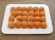 Fresh apricots on display for sale in a produce shop in Boston.