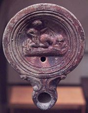 Roman oil lamp depicting coitus more ferarum