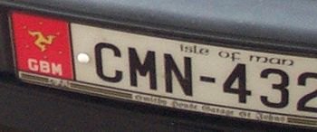 Car registration plate featuring the Manx triskelion.