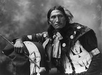 Eddie Plenty Holes, a LAKOTA SIOUX photographed about 1899.