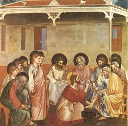 Jesus washes the feet of his disciples.