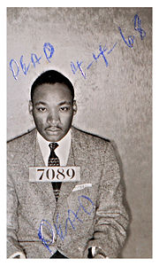 Martin Luther King Jr., after his arrest in February of 1956, at the age of 27. He had been arrested during the Montgomery Bus Boycott. The mug shot was found in July, 2004, during the cleaning out of a storage room at the Montgomery County Sheriff's Department. Someone had written "DEAD" twice on the picture, as well as 4-4-68, the date King was killed, though it is not known who wrote it.