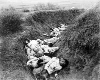 Filipino casualties on the first day of Philippine-American War. Original caption is 'Insurgent dead just as they fell in the trench near Santa Ana, February 5. The trench was circular, and the picture shows but a small portion.'