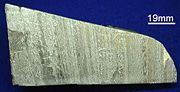A piece of aluminum metal about 15 centimeters long.