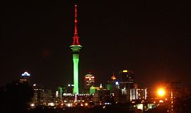 Sky Tower illuminated in Christmas colors during the month of December.