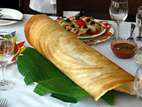 Masala dosa served in a restaurant in southern India. Indian cuisine is characterized by the widespread practice of vegetarianism across India's populace.