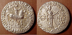 Triratna symbol on the reverse (left field) of a coin of the Indo-Scythian king Azes II (r.c. 35-12 B.C.E.).