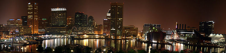 A nighttime panorama of Baltimore's Inner Harbor.