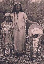 Southern Paiutes  – Moapa - Las Vegas Paiutes wearing traditional Paiute basket hats. Paiute cradleboard and rabbit robe