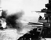 The USS New York firing her 14" main guns on the island, February 16, 1945