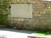 A plaque honors the dead of the Commune in Père Lachaise cemetery.