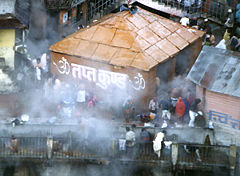 Tapt Kund hot springs next to Badrinath Temple, enclosed inside bath house.