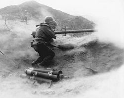 3rd U.S. Infantry Division, fire their weapon at Chinese Communist position on Hill 200