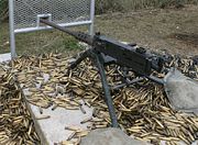 A .50 caliber M2 machine gun surrounded by spent shell casings: John Browning's design has been one of the longest serving and successful machine gun designs