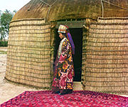 A Uzbek woman at the entrance to a yurt in 1913. Picture by Prokudin-Gorskii.