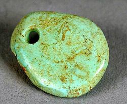 Trade in turquoise crafts, such as this freeform pendant dating from 1000–1040 C.E., is believed to have brought the Ancestral Puebloans of the Chaco Canyon great wealth