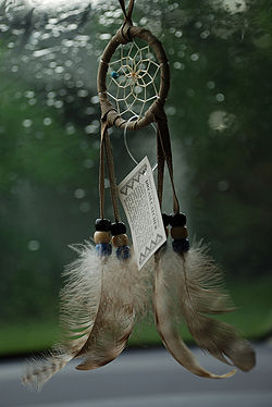 A dreamcatcher. The good dreams find their way to the center, down the feathers, and to the sleeping person it protects.