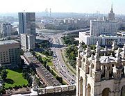Mayor's office (former Comecon headquarters) highrise to the left and Russian government to the right, view from Kudrinskaya square Stalin skyscraper.