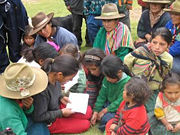 Peruvian indigenous people, learning to read.