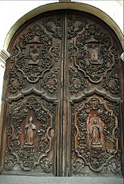 The ornately carved main door of Church of San Agustin.