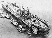 The battleship  USS Iowa uses a floating dry dock during World War II.
