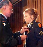 Army PFC Jessica Lynch receiving the Purple Heart in 2003.
