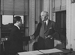 Hull and Chinese Ambassador Wey Daw-ming at the State Department exchanging ratifications of the treaty abolishing extra-territorial "rights" of the United States in China.