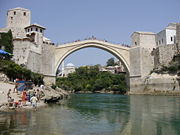 The famous bridge in Mostar, Bosnia, built in 1556, destroyed during the War in Bosnia and subsequently rebuilt. Sells describes this bridge as "a symbol of Bosnia’s role in bridging cultures" and suggests that border zones should be re-imagined as places of cooperation not conflict..