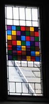 Stained glass window in the dining hall of Caius College, in Cambridge, commemorating Ronald Fisher and representing a Latin square.