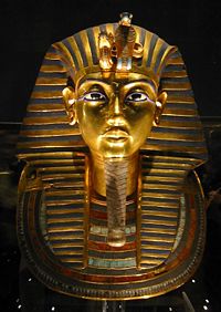 Mask of Tutankhamen's mummy in its dim underlighting at the Egyptian Museum.