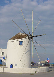 A fixed windmill typical of the Cyclades Islands.