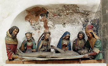 Joseph of Arimathea (right) and Nicodemus (left) with the Virgin Mary, two female disciples, and the Beloved Disciple attending to the body of Jesus.
