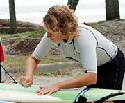 Waxing a surfboard