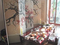 An elaborate offering table of food prepared for a Jesa, a Confucian ritual to honor ones ancestors.