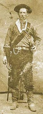 William Callicot, one of McNelly's Rangers, 1875. Callicot is wearing sombrero and cross-draw holster, typical of Rangers of the period.