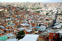 Housing known as barrios crowd some hillsides of the city.