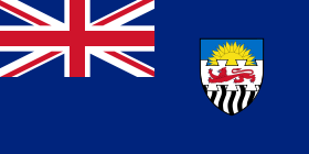 The Flag of the Federation of Rhodesia and Nyasaland. On the shield, the rising sun represents Nyasaland, the lion Southern Rhodesia, and the black and white wavy lines Northern Rhodesia.