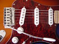 Electric guitar with three pickups