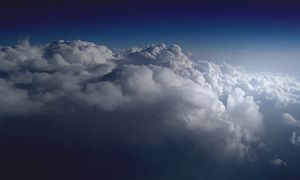 Stratocumulus perlucidus clouds, as seen from an airplane window.