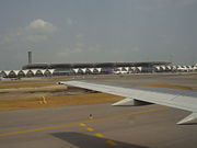 Concourse D at Suvarnabhumi International Airport as seen from a taxiing plane.