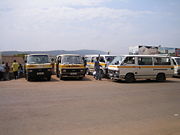 A row of minibus share taxis, the principal form of public transport, waiting to depart in Kigali.
